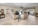 Open living room with tile floors, neutral decor, and access to a screened lanai at 4327 Gullane Dr, Lake Wales, FL 33859