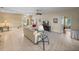 Spacious living room featuring tile floors, neutral walls, and seamless flow to other living areas at 4327 Gullane Dr, Lake Wales, FL 33859