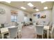 Inviting meeting room with tables, chairs, soft lighting, and tasteful decor for comfortable gatherings at 4327 Gullane Dr, Lake Wales, FL 33859