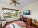 Well-lit home office area features a desk with lake views offering an inspiring workspace at 4327 Gullane Dr, Lake Wales, FL 33859