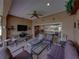 Inviting covered patio with outdoor seating and a scenic view, ideal for relaxation and entertaining at 4327 Gullane Dr, Lake Wales, FL 33859