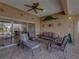 Relaxing covered patio with comfortable seating area and view of the scenic outdoors at 4327 Gullane Dr, Lake Wales, FL 33859