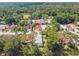 Aerial view of the neighborhood with tree coverage, showcasing the home's surroundings at 441 San Jose Dr, Winter Haven, FL 33884