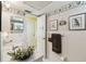 Well-lit bathroom featuring a white vanity, neutral decor, and decorative botanical art at 441 San Jose Dr, Winter Haven, FL 33884