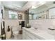 Neutral bathroom featuring a white vanity, tile walls, and decorative accents at 441 San Jose Dr, Winter Haven, FL 33884
