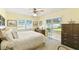 Bright, cozy bedroom with natural light, large windows, and neutral decor at 441 San Jose Dr, Winter Haven, FL 33884