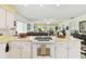 Open kitchen with ample counter space and view into the spacious living area at 441 San Jose Dr, Winter Haven, FL 33884