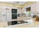 Well-lit kitchen featuring tile flooring and updated appliances at 441 San Jose Dr, Winter Haven, FL 33884