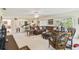 Open-concept kitchen and living room with white cabinets and barstool seating for entertaining at 441 San Jose Dr, Winter Haven, FL 33884