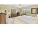 Bright main bedroom with a large window and neutral decor at 441 San Jose Dr, Winter Haven, FL 33884