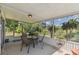 Relaxing screened-in patio area with outdoor seating and views of the lush backyard at 441 San Jose Dr, Winter Haven, FL 33884