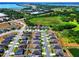 Aerial view of the community with a lake and nature views at 476 Haines Trl, Winter Haven, FL 33881
