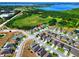 Aerial view of the community with a lake and nature views at 476 Haines Trl, Winter Haven, FL 33881