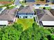 Aerial view of the backyard with a lush lawn at 476 Haines Trl, Winter Haven, FL 33881