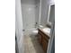Well-lit bathroom with a shower-tub combination and a granite-topped vanity at 476 Haines Trl, Winter Haven, FL 33881