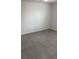 Empty bedroom with tile floors, a window, and light-grey painted walls at 476 Haines Trl, Winter Haven, FL 33881