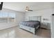 Spacious main bedroom with large window, ceiling fan, and light blue accents at 476 Haines Trl, Winter Haven, FL 33881
