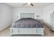 Comfortable main bedroom with a serene gray and white color scheme at 476 Haines Trl, Winter Haven, FL 33881