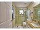 Bathroom featuring a glass shower, granite countertop, vanity, and neutral tile flooring at 492 Sweetwater Way, Haines City, FL 33844