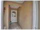 Neutral entryway with tile flooring, decorative accents, and a welcoming entrance door at 492 Sweetwater Way, Haines City, FL 33844