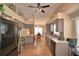 Open-concept kitchen with grey cabinets, stainless steel appliances and eat-in dining area at 492 Sweetwater Way, Haines City, FL 33844