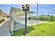 Enjoy outdoor recreation with this shuffleboard court and shaded seating area, ideal for social activities and leisurely afternoons at 492 Sweetwater Way, Haines City, FL 33844