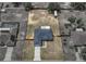 Aerial view shows a spacious fenced-in yard with a single-Gathering home and long driveway at 541 Hatchwood Dr, Haines City, FL 33844