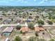 Aerial view of the neighborhood showing the home's location among mature trees and residential streets at 541 Hatchwood Dr, Haines City, FL 33844