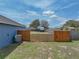 View of the home's backyard and fence at 541 Hatchwood Dr, Haines City, FL 33844