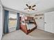 Bedroom featuring a bunk bed, carpet, neutral walls, blinds and a ceiling fan at 541 Hatchwood Dr, Haines City, FL 33844