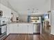 Bright kitchen with stainless steel dishwasher open to the living room at 541 Hatchwood Dr, Haines City, FL 33844