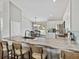 Bright kitchen with a marbled quartz countertop, a breakfast bar, and seating for three at 541 Hatchwood Dr, Haines City, FL 33844