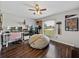 Bright, spacious home office featuring laminate floors, natural light, and ceiling fan at 541 Hatchwood Dr, Haines City, FL 33844