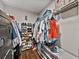 Walk-in closet with organized storage for shoes, clothes, and accessories at 541 Hatchwood Dr, Haines City, FL 33844