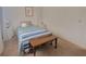 Simple bedroom featuring a comfortable bed, side tables, and a bench, creating a cozy and inviting space at 5702 Breskin Dr, Orlando, FL 32839