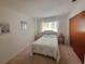 Tranquil bedroom with a cozy bed, side tables, and soft lighting, offering a peaceful retreat at 5702 Breskin Dr, Orlando, FL 32839
