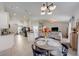 Cozy dining area adjacent to the kitchen, featuring a round table and stylish lighting at 620 Jaxson Blvd, Winter Haven, FL 33880