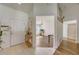 Bright foyer with tile floors, front door, and view into the living room at 620 Jaxson Blvd, Winter Haven, FL 33880