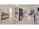 Hallway view of the kitchen with stainless steel appliances, and white cabinetry at 620 Jaxson Blvd, Winter Haven, FL 33880