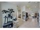 Hallway featuring a cat tree, tile flooring, and providing access to other areas of the home at 620 Jaxson Blvd, Winter Haven, FL 33880
