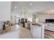 Bright kitchen boasts lots of countertop space, stainless steel appliances, and an open layout to the living area at 620 Jaxson Blvd, Winter Haven, FL 33880