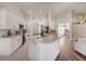 Spacious kitchen featuring a breakfast bar, ample cabinet space, and open access to the living area at 620 Jaxson Blvd, Winter Haven, FL 33880