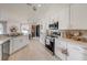Well-equipped kitchen with stainless appliances, ample counter space, and easy access to the dining area at 620 Jaxson Blvd, Winter Haven, FL 33880