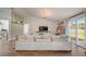Bright living room features wood floors, neutral décor, and sliding glass doors at 620 Jaxson Blvd, Winter Haven, FL 33880