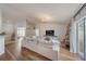 Open concept living room featuring wood floors and a comfortable seating area at 620 Jaxson Blvd, Winter Haven, FL 33880