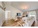 Spacious living room with vaulted ceiling, wood floors, and access to the backyard at 620 Jaxson Blvd, Winter Haven, FL 33880