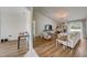 Bright and airy living room features wood floors, neutral décor, and ample natural light at 620 Jaxson Blvd, Winter Haven, FL 33880