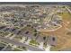 Expansive aerial view of a neighborhood featuring modern homes and well-maintained streets, some with solar panels at 622 Taft Dr, Davenport, FL 33837