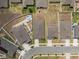 Overhead view of homes with landscaped yards, modern architecture, and a community layout, some including a small spa at 622 Taft Dr, Davenport, FL 33837