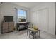 Comfortable bedroom featuring a window, closet, and tile flooring at 622 Taft Dr, Davenport, FL 33837